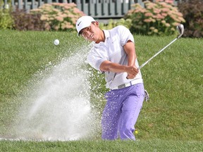 Cheng-Tsung Pan of Taiwan blasts out of a sand trap onto the 18th green during the second round of the Mackenzie Tour PGA Tour Canada Great Waterway Classic at the Loyalist Golf and Country Club in Bath, Ontario on Friday August 28 2015. He got a birdie on the hole. Ian MacAlpine /Kingston Whig-Standard/Postmedia Network.