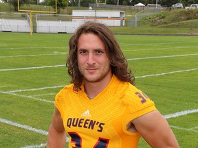 Queen's Golden Gaels football running back Jesse Andrews models the football jersey at Richardson Stadium on Thursday August 27 2015. IThe team will wear them for their season opener at home on Sunday against Carleton. Ian MacAlpine /Kingston Whig-Standard/Postmedia Network.