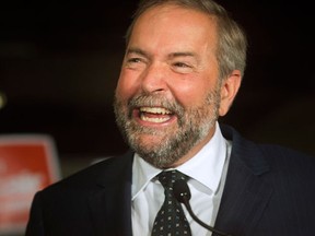 NDP Leader Tom Mulcair talks to supporters and the press as he takes his campaign to the new federal riding of Notre-Dame-de-Grace-Westmount, in Montreal, on Friday, August 28, 2015. (THE CANADIAN PRESS/Peter McCabe)