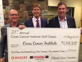 Check out this cheque! $1,143,315 presented to Dr. John Lewis (centre) by Harry Kipnes of Digital Communications (left) and Cross Cancer Institute Golf Classic Committee Chair John Kopeck.