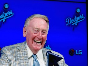 Los Angeles Dodgers Hall of Fame broadcaster Vin Scully announces he will return to broadcast his 67th, and last baseball season in 2016, during a news conference in Los Angeles, Saturday, Aug. 29, 2015. (AP Photo/Alex Gallardo)