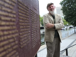 Kevin Dooley stands near the Rideau Canal in Ottawa Wednesday Aug 26, 2015. Kevin led a campaign to get a plaque erected in honour of the men who died building the Rideau Canal. Tony Caldwell/Ottawa Sun/Postmedia Network