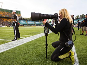 Johany Jutras, creator of the CFL Road Trip, a photo book documenting the CFL culture across the league, is seen during the Edmonton Eskimos' CFL football game against the Toronto Argonauts at Commonwealth Stadium in Edmonton, Alta. on Friday, Aug. 28, 2015. Codie McLachlan/Edmonton Sun/Postmedia Network