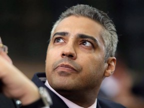 FILE -- Canadian Al-Jazeera English journalist Mohamed Fahmy, right, listens to his lawyer, Khaled Abou Bakr during his retrial in a courtroom, of Tora prison, in Cairo, Egypt, Monday, June 1, 2015. An Egyptian court has sentenced Fahmy and two other Al-Jazeera English journalists to three years in prison, the last twist in a long-running trial criticized worldwide by press freedom and human rights activists. (THE CANADIAN PRESS/AP, Amr Nabil)