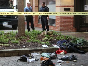 Police are investigating a downtown London assault that critically injured a man. Investigators remained on the scene at a courtyard near Dufferin Avenue and Richmond Street Saturday morning. DALE CARRUTHERS / THE LONDON FREE PRESS