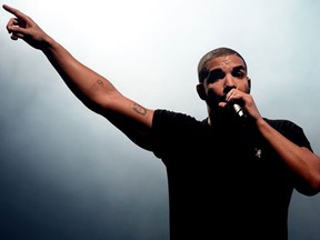 FILE - In this June 27, 2015, file photo, Canadian singer Drake performs at the Wireless festival in Finsbury Park, in London. Drake has broken his silence on a deadly shooting at an after-party for his music festival at a downtown Toronto nightclub Aug. 4. (Photo by Jonathan Short/Invision/AP, File)