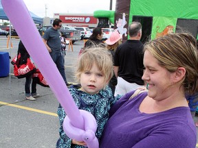 Quinn Gilchrist, two and a half, shows off her new balloon sword along with mother Samantha at New Sudbury Days in 2015. Ben Leeson/The Sudbury Star/Postmedia Network