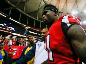 Julio Jones #11 of the Atlanta Falcons walks off the field after beating the Arizona Cardinals at the Georgia Dome on November 30, 2014 in Atlanta, Georgia. The Falcons won 29-18.   Kevin C. Cox/Getty Images/AFP