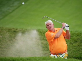 John Daly hits out of a bunker on the 18th hole during the second round of the PGA Championship golf tournament Friday, Aug. 14, 2015, at Whistling Straits in Haven, Wis. (AP Photo/Chris Carlson)