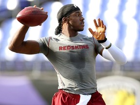Quarterback Robert Griffin III #10 of the Washington Redskins warms up prior to the start of a preseason game against the Baltimore Ravens at M&T Bank Stadium on August 29, 2015 in Baltimore, Maryland.   Matt Hazlett/ Getty Images/AFP