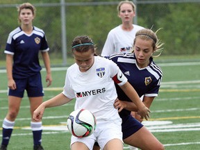 OSU 2000 Force Academy's Emily Amano (white jersey) battles for position with North London Galaxy's Victoria Kyriakopoulos during Ontario Cup girls under-15 soccer semifinal action at James Jerome Sports Complex on Saturday. North London won 3-0. Ben Leeson/The Sudbury Star/Postmedia Network