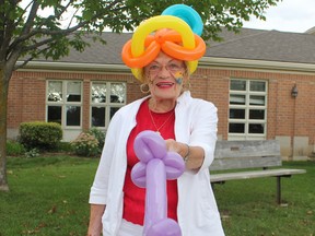 Resident Sandra Anderson shows off her face paint and balloons at the Huronview carnival last Thursday. (Laura Broadley/Clinton News Record)