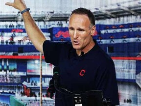 In this Thursday, Aug. 7, 2014, file photo, Cleveland Indians president Mark Shapiro points out the major renovations to right field at Progressive Field in Cleveland. Shapiro, who has been with Cleveland since 1992, will replace Paul Beeston, the Toronto Blue Jays CEO and president who is retiring. (AP Photo/Tony Dejak, File)