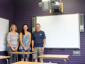 Tina Betz, Kym Wasylik-Nicoll and Derek Collins, staff of the Vermilion Outreach School pose in front of the classroom in their new building located on 50 Ave.