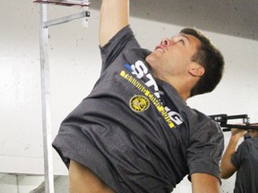 New Sarnia Sting defenceman Josh Jacobs tries to hit the top bars in the high jump challenge as the Ontario Hockey League team's training camp began with fitness testing at RBC Centre on Monday August 31, 2015 in Sarnia, Ont. (Terry Bridge, The Observer)
