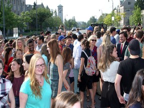 Queen's University students, officials, City of Kingston staff and politicians take part in the first scramble crossing at Union Street and University Avenue on the Queen's University campus. (Ian MacAlpine/The Whig-Standard)