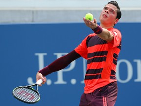 Milos Raonic of Canada serves to Tim Smyczek of the United States during the U.S. Open tennis tournament at USTA Billie Jean King National Tennis Center in New York on Aug. 31, 2015. (Jerry Lai/USA TODAY Sports)