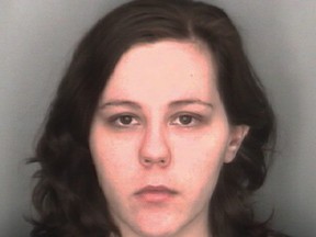 In this undated booking photo released by the Redford Township, Mich., Police Department, Kimberly Pappas, 26, is shown. The Detroit-area woman accused of giving birth at work and hiding the boy in a plastic bag in a desk drawer was ordered Monday, Aug. 24, 2015, to stand trial on murder and child abuse charges. (Redford Township Police Department via AP)