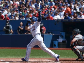 Josh Donaldson of the Toronto Blue Jays hits a solo home run against the Detroit Tigers on August 30, 2015 at Rogers Centre in Toronto on Aug. 30, 2015. (Tom Szczerbowski/Getty Images/AFP)