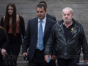 Ivan Henry, right, who was wrongfully convicted of sexual assault in 1983, leaves B.C. Supreme Court during a lunch break in Vancouver, B.C., on Monday August 31, 2015. Henry is suing prosecutors for allegedly breaching his charter rights after he was acquitted in 2010 of 10 sexual-assault convictions. THE CANADIAN PRESS/Darryl Dyck