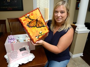 Katie Dean, of the Pregnancy and Infant Loss Network, treasures the memory box from the baby she lost. The network holds its second annual butterfly release picnic Sept. 20. (MORRIS LAMONT, The London Free Press)