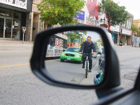 New traffic laws in Ontario, include higher fines for opening a car door in the path of a cyclist. (DEREK RUTTAN, The London Free Press)