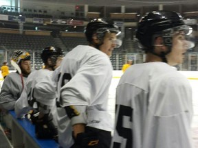 Rookie defenceman Konstantin Chernyuk, centre, and Jakob Brahaney take part in a scrimmage at the Rogers K-Rock Centre on Monday. (Doug Graham/The Whig-Standard)