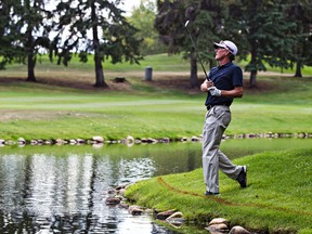 Gary Ward checks on the flight of his ball on the 18th hole during opening-round play of the Alberta PGA Tour Championship at the Royal Mayfair (Codie McLachlan, Edmonton Sun).