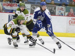 North Bay Battalion's Ray Huether tries to block a shot from Sudbury Wolves' Chad Heffernan during OHL action at  Sudbury Community Arena last season. Gino Donato/The Sudbury Star/Postmedia Network