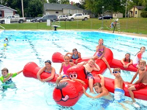 Even though it was rainy and cold, Mitchell and area kids braved the weather to enjoy “Fun Day” with a Clifford the Big Red dog float toy at the West Perth Lions Pool last Wednesday, Aug. 26. GALEN SIMMONS/MITCHELL ADVOCATE