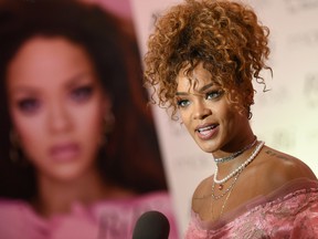 Singer Rihanna attends the "RiRi by Rihanna" fragrance launch at Macy's on Monday, Aug. 31, 2015, in the borough of Brooklyn, N.Y. (Photo by Evan Agostini/Invision/AP)