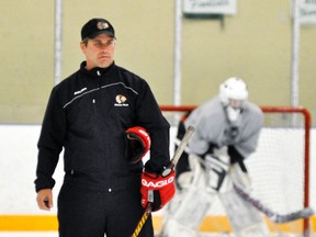 Under the guidance of coach Duane Harmer (above), the Mitchell Jr. C Hawks are working towards a good start to the 2015-16 Western Jr. C hockey season. They are looking for improved goaltending, after bringing back netminder Graeme Lauersen (in background) to play the majority of the games. ANDY BADER/MITCHELL ADVOCATE