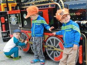 Max, 2, and twins Jaxon and Mason, 3, await their turn to ride aboard the Seaway Kiwanis Club's Canatara Choo Choo train during the Lochiel Kiwanis Community Centre's second annual Heritage Picnic on Aug. 27.
CARL HNATYSHYN/SARNIA THIS WEEK