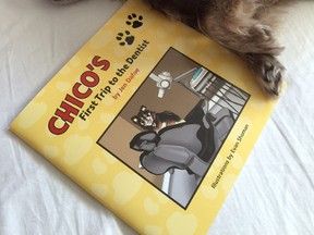 Chico, a 10-pound Peka-Tzu Chorkie, relaxes in bed with a copy of Sarnia author Jen Dafoe's book, Chico's First Trip to the Dentist. The book will soon be hitting the shelves of Winners and Marshalls stores across the country. 
submitted photo for SARNIA THIS WEEK