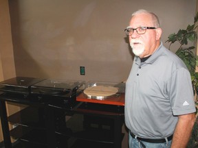 St. Clair Audio Video Unlimited's Grev Martin stands with three new turntables for sale at the store's London Road location. The store will soon be opening a new space exclusively for turntables due to high demand. 
CARL HNATYSHYN/SARNIA THIS WEEK