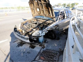 This vehicle suffered significant damage after a hit-and-run crash on the Champlain Bridge on Aug. 27. RCMP are seeking a dark pickup truck in connection with the collision. (RCMP submitted image)