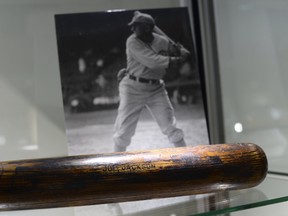 A 1911 Shoeless Joe Jackson game-used bat on display during the media preview February 20, 2014 in New York of Heritage Auctions. (AFP PHOTO/Timothy Clary)
