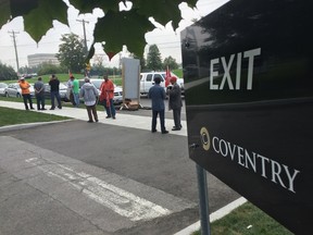 Taxi drivers continue their ongoing protest over passenger pickup fee increases at the Ottawa Airport, in front of the Coventry Connections office on Coventry Dr., on Tuesday. (TONY CALDWELL Ottawa Sun)