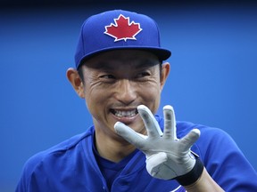 Munenori Kawasaki of the Toronto Blue Jays during batting practice before a game against the Minnesota Twins at Rogers Centre in Toronto on August 5, 2015. (Tom Szczerbowski/Getty Images/AFP)