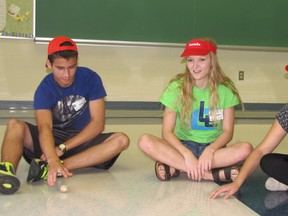 Alexandra Badder (centre) leads incoming UCC students Dylan Morton and Emma Smulders in an orientation activity as part of the Lancer Link program on Monday. The program connects student leaders from Grade 11 and 12 with Grade 9 students to help ease their transition into high school life. (Blair Andrews, Postmedia Network)