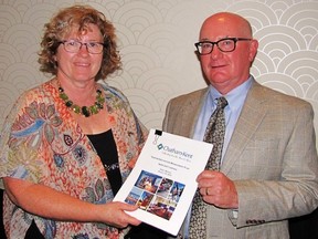 Susanne Spence-Wilkins, co-chair of the Tourism Stakeholders Advisory Council, and Richard Innes, a consultant with Brain Trust Marketing and Communications, hold a copy of the CK Tourism Destination Management Plan draft. (Blair Andrews, Postmedia Network)