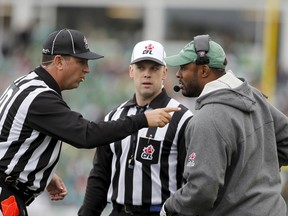 Roughriders head coach Corey Chamblin talks with referees during CFL action against the Stampeders in Regina on Aug. 22, 2015. Chamblin, along with GM Brendan Taman, were fired on Aug. 31 following the team's ninth straight loss to start the season. (David Stobbe/Reuters)
