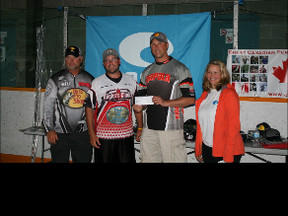 Mike Desforges (left) and Clint Hurd (second from right) collect their winner's cheque at the Top 50 Classic in Parry Sound on Saturday.