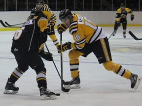 Team Gold forward Alex Renaud tries to deke Team Black defenceman Nash Nienhuis, but the Sarnia native stands him up. The teams faced off in a scrimmage Tuesday morning at RBC Centre. (Terry Bridge, The Observer)