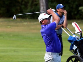 Mike Belbin hits his second shot on the 18th hole as he closes out his winning round of the PGA of Alberta Tour Championship on Tuesday at the Royal Mayfair Golf Club. (Perry Mah, Edmonton Sun)