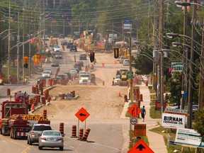 Roadwork continues on Commissioners Road, west of Wharncliffe Road near Andover Drive in London Tuesday as London nears the end of another busy construction season. (MIKE HENSEN, The London Free Press)