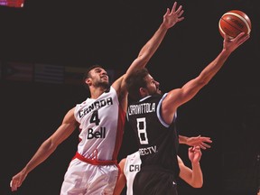 Argentina’s Nicolas Laprovittola goes up for a layup against Canada’s Phil Scrubb during their game at the FIBA Americas on Tuesday. (Ernesto Perez M./FIBA Americas)