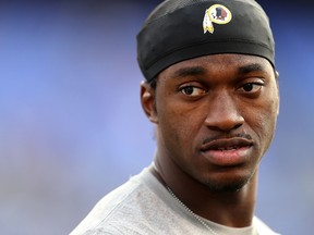 Quarterback Robert Griffin III #10 of the Washington Redskins looks on prior to the start of a preseason game against the Baltimore Ravens at M&T Bank Stadium on August 29, 2015 in Baltimore, Maryland.   Matt Hazlett/ Getty Images/AFP