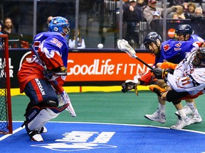 Brandon Miller of the Toronto Rock stops a shot by John Tavares (11) of the Buffalo Bandits during NLL action at the Air Canada Centre in Toronto on Saturday March 14, 2015. (Dave Abel/Toronto Sun/Postmedia Network)