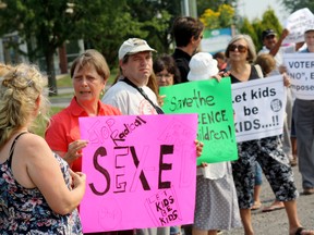 SARAH HYATT/THE INTELLIGENCER
About two dozen protestors rallied outside MPP Todd Smith’s office in Belleville, Wednesday. They were calling for changes to the new sex-ed curriculum and to “stop radical sex-ed.” Protestors in Belleville joined 107 simultaneous protests province-wide.